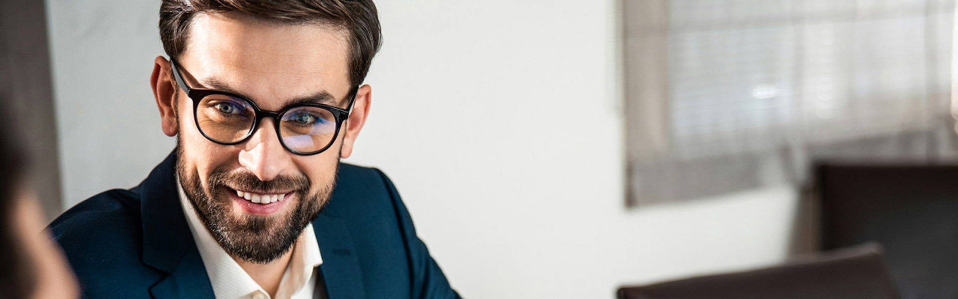 hipaa-banner White male in glasses reviews HIPAA compliance with a male healthcare practice