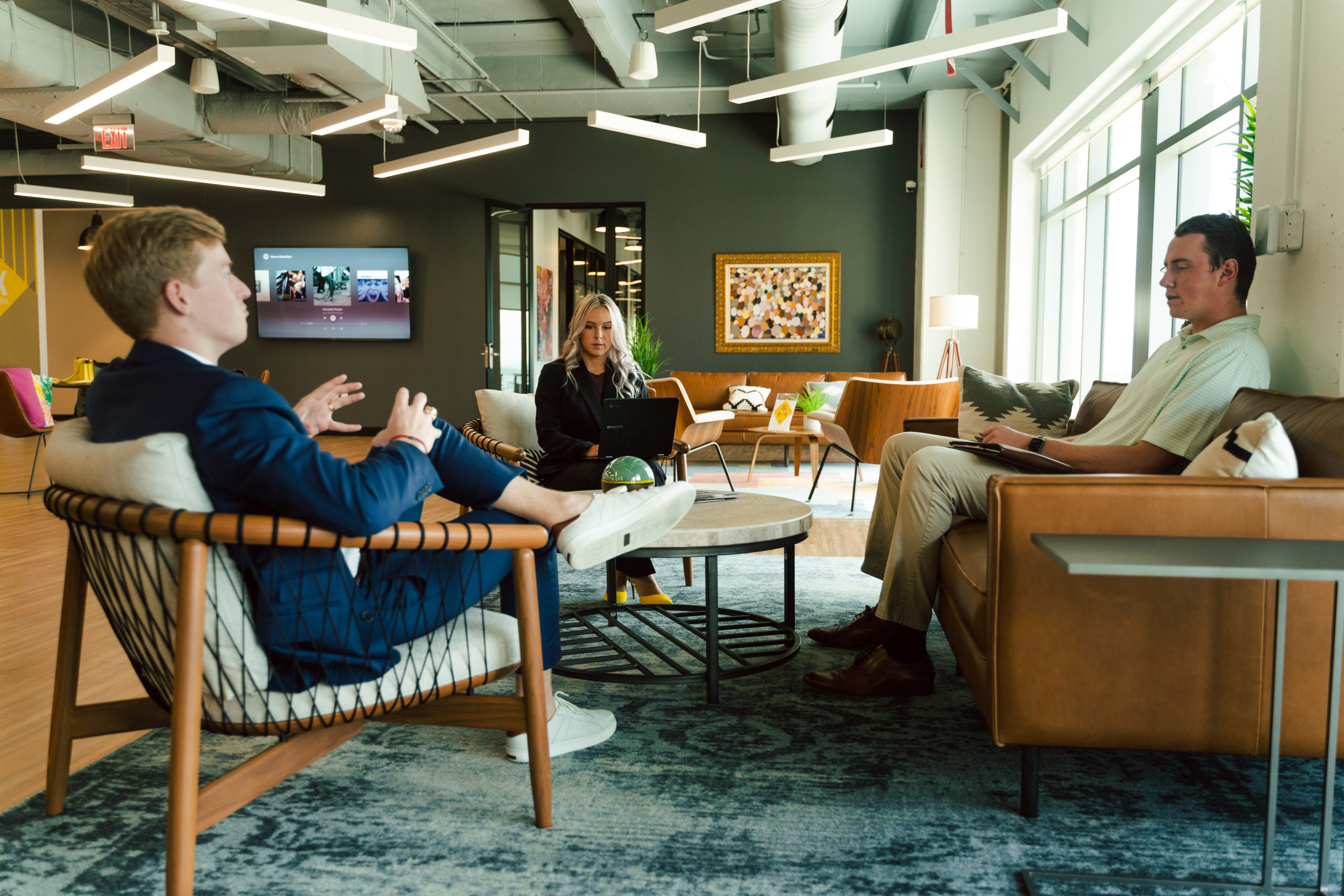 venture-x-office Healthcare Consulting Contact Venture X Office with three people sitting in the lobby working